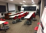 White steelcase brand desks and red node chairs